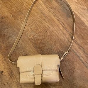 Senreve Aria belt bag with long chain.